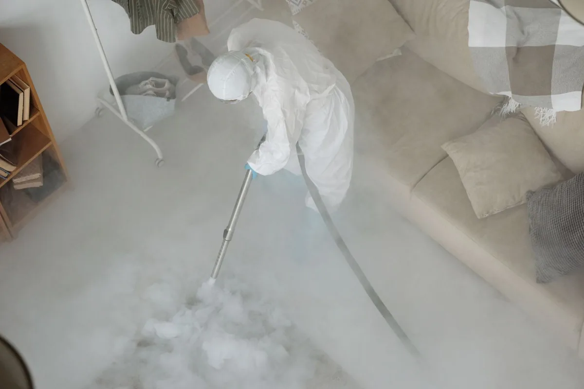 Biohazard cleanup technician in protective equipment, Sullivan City, TX